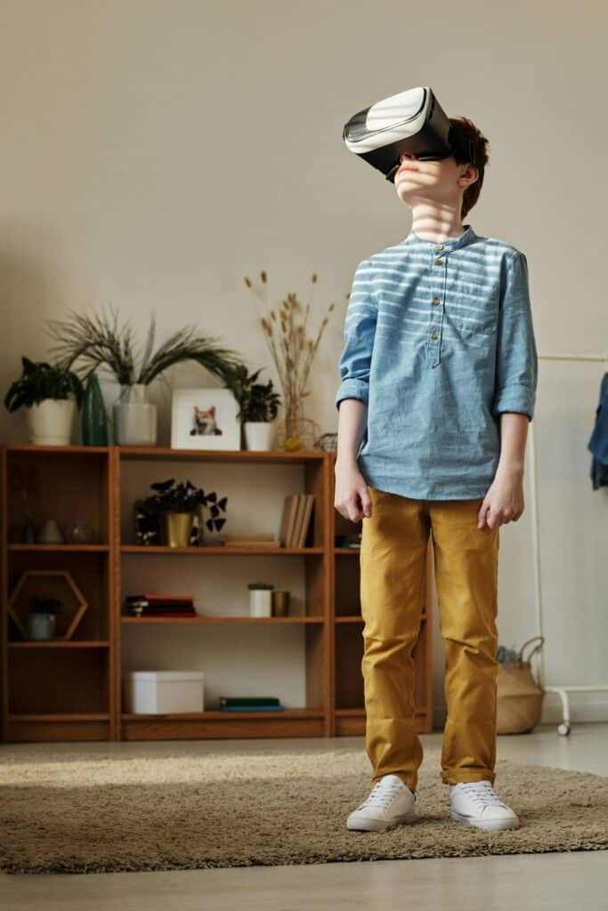 Contact Us, A young boy wearing VR goggles, exploring virtual reality in a cozy living room.